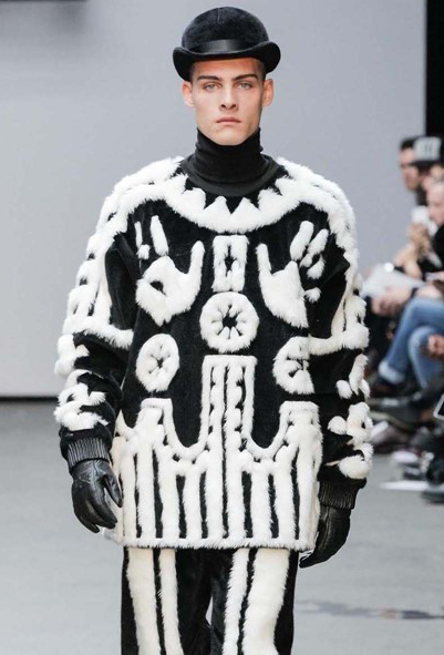 A model walks the runway at the KTZ Autumn Winter 2015 fashion show